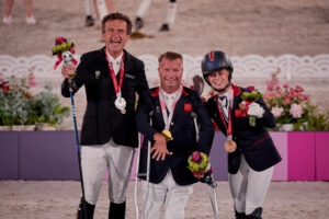 Tokyo 2020 Paralympic Games - Individual Grade II
Pepo Puch (AUT) silver, Lee Pearson (GBR) gold, and Georgia Wilson (GBR) bronze on the podium at the grade 2 individual medal ceremony 

Photo Copyright © FEI/Liz Gregg