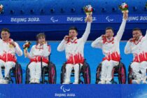 (l-r) Yulong Sun CHN, Zhuo Yan CHN, Mingliang Zhang CHN, Jianxin Chen CHN, and Haitao Wang CHN celebrate on the podium after winning the Wheelchair Curling Gold Medal match against Sweden at the National Aquatics Centre. Beijing 2022 Winter Paralympic Games, Beijing, China, Saturday 12 March 2022. Photo: OIS/Bob Martin. Handout image supplied by OIS/IOC